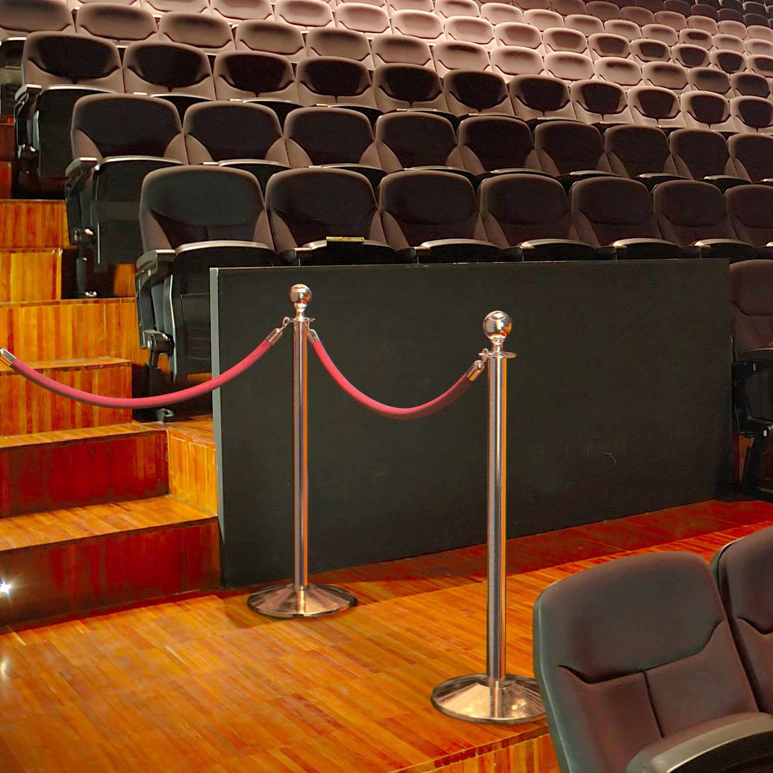 Ball top rope stanchions in use with velvet rope