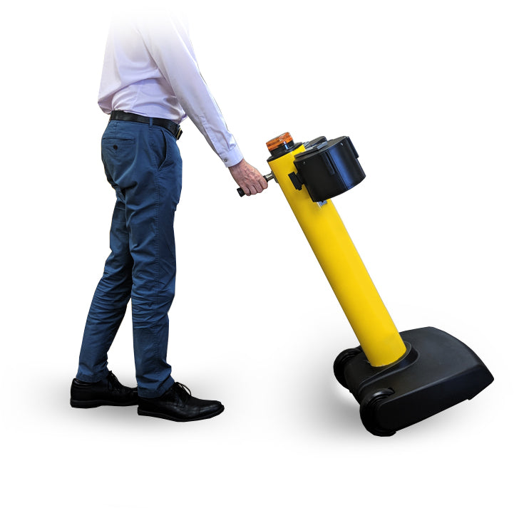 SkyPro 1500 Ultra Long Retractable belt Stanchion Barrier being pushed on it's rolling wheel base